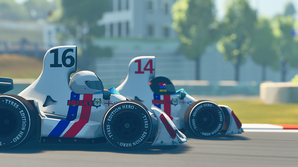 Fotografia da cena do jogo Formula Legends. Imagem de carros de corrida.